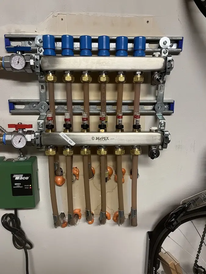 Plumber performing Water Heater Repair at a residential property in Gunnison